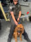 Policeman holding his police dog