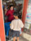 Woman giving out candy to a young boy
