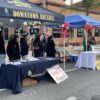 The Downtown Arcadia booth with volunteers working